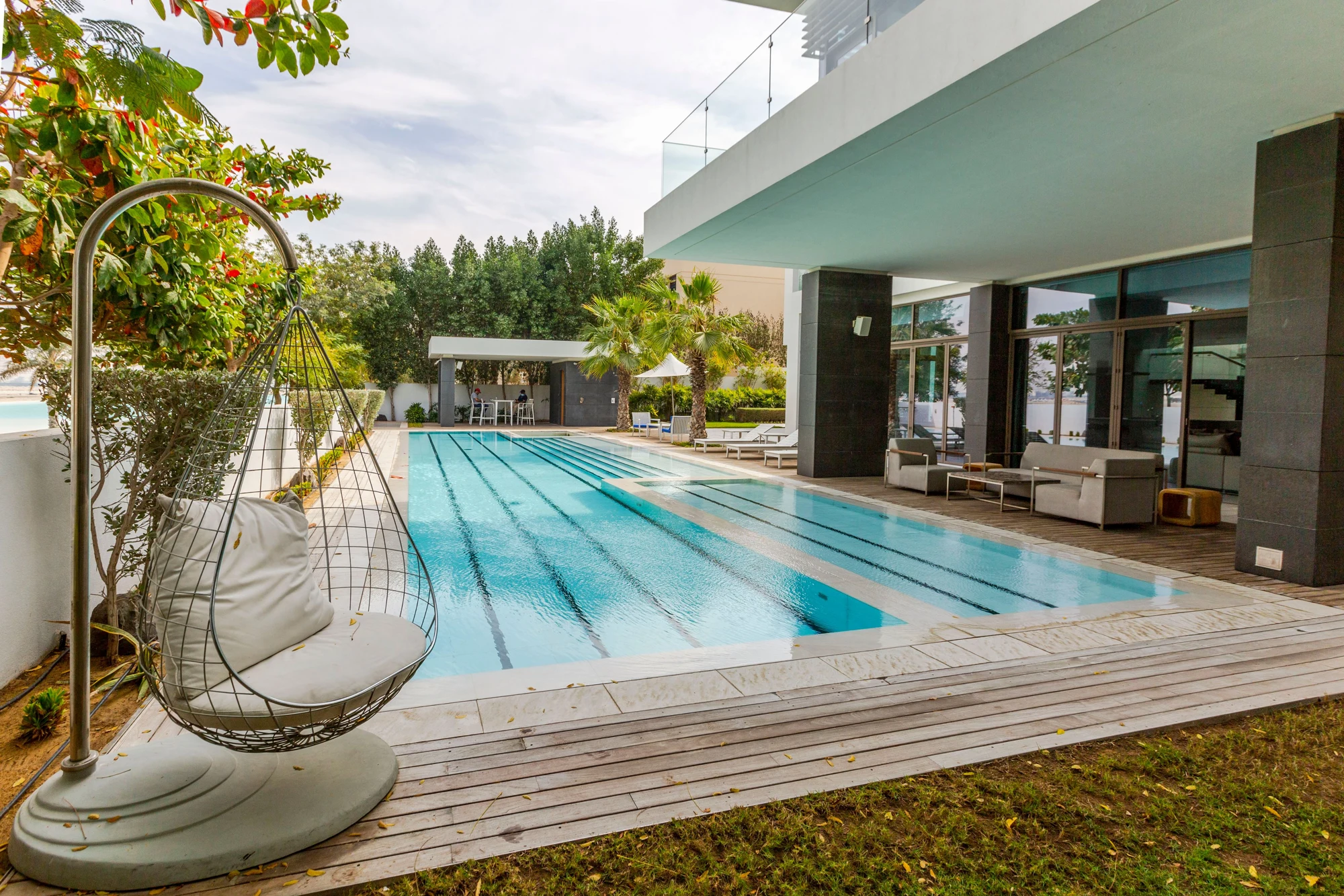 Modern pool terrace shown as outdoor design inspiration from licensed stock imagery